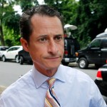 U.S. Rep. Anthony Weiner, D-N.Y., returns to his Forest Hills home after a news conference during which he annouced his intention to resign, Thursday, June 16, 2011, in the Queens borough of New York. Weiner has decided to resign his seat in Congress after a two-week scandal spawned by lewd photos the New York lawmaker took of himself and sent online to numerous women. (AP Photo/Jason DeCrow)