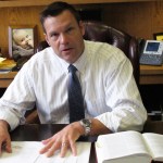 In this Friday, Sept. 12, 2014 photo, Kansas Secretary of State Kris Kobach discusses his office's legal research for an elections case before the state Supreme Court during an interview in his office in Topeka, Kan. Democrat Chad Taylor has petitioned the Supreme Court to remove his name from the ballot for the U.S. Senate after Kobach refused to do it. (AP Photo/John Hanna)
