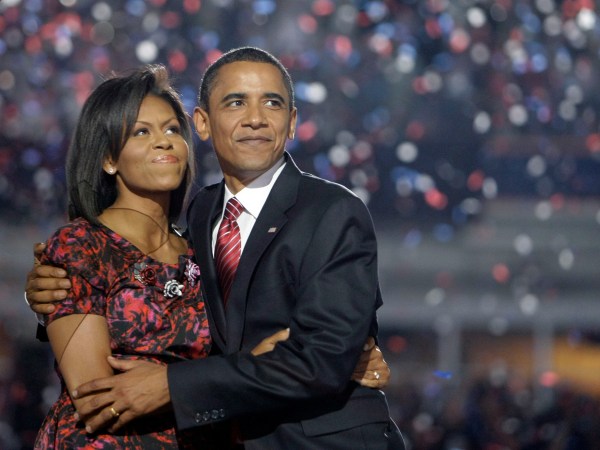Democratic presidential candidate, Sen. Barack Obama, D-Ill., hugs his wife, Michelle Obama, after giving his acceptance speech at the Democratic National Convention at Invesco Field at Mile High in Denver Thursday, Aug. 28, 2008.(AP Photo/Alex Brandon)