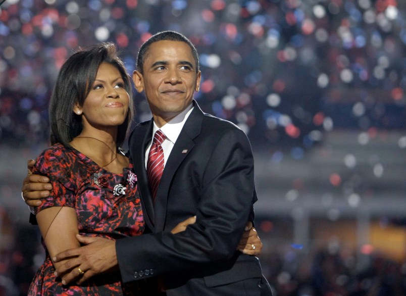 Democratic presidential candidate, Sen. Barack Obama, D-Ill., hugs his wife, Michelle Obama, after giving his acceptance speech at the Democratic National Convention at Invesco Field at Mile High in Denver Thursday, Aug. 28, 2008.(AP Photo/Alex Brandon)