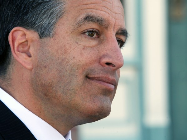 NVLI107-Nevada Governor Brian Sandoval stands on the front steps of the historic Fallon Old Post Office built in 1929 after speaking at the Grand Opening of Young Entrepreneurs Collective in Fallon Nevada. Thursday, March. 27, 2015 (AP Photo/Lance Iversen