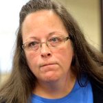 Rowan County Clerk Kim Davis listens to a customer following her office's refusal to issue marriage licenses at the Rowan County Courthouse in Morehead, Ky., Tuesday, Sept. 1, 2015. Although her appeal to the U.S. Supreme Court was denied, Davis still refuses to issue marriage licenses. (AP Photo/Timothy D. Easley)