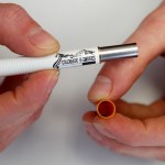 This photo taken on Wednesday, Mar. 2, 2011, shows XXXXXX as he demonstrates 
at an E-Smokes store in Aurora, Colo.  (AP Photo/Ed Andrieski)
