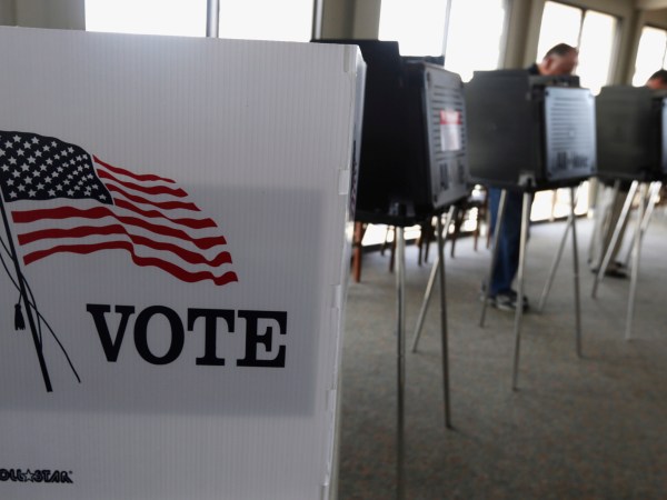 FILE - In this March 18, 2014 file photo, voters cast their ballots in the Illinois primary in Hinsdale, Ill. Illinois voters head to the polls next week to cast critical primary ballots for offices from U.S. president to county recorder. Ahead of the contests, a government watchdog group teamed up with a Chicago information technology company to examine voter records and Census data over four elections, an analysis they say hasn't been as easily accessible to the public before now. Officials with Illinois Campaign for Political Reform hope it willl contribute to more voter participation. (AP Photo/M. Spencer Green, File)