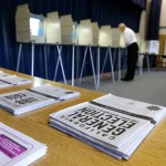 FILE - In this Nov. 4, 2014, file photo, a voter marks his ballot while voting in Elk Grove, Calif. Oregon is the first state to adopt the idea that it is the government's responsibility to register voters — a move that could increase the number of registered voters by 13 percent by the November election. California has approved similar legislation, and automatic registration bills have been introduced in more than a dozen other states. (AP Photo/Rich Pedroncelli, File)