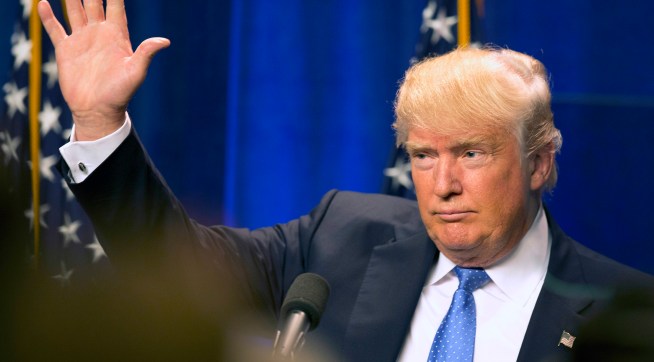 Republican presidential candidate Donald Trump waves to supporters after giving a speach at Saint Anselm College Monday, June 13, 2016, in Manchester, N.H. (AP Photo/Jim Cole)