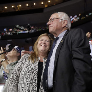 Former Democratic presidential candidate, Sen. Bernie Sanders, I-Vt., hugs wife Jane after standing with the Vermont delegation and asking that Hillary Clinton become the unanimous choice for President of the United States during the second day of the Democratic National Convention in Philadelphia , Tuesday, July 26, 2016. (AP Photo/Matt Rourke)