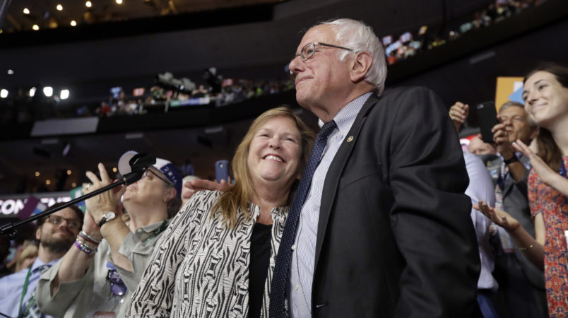 Former Democratic presidential candidate, Sen. Bernie Sanders, I-Vt., hugs wife Jane after standing with the Vermont delegation and asking that Hillary Clinton become the unanimous choice for President of the United States during the second day of the Democratic National Convention in Philadelphia , Tuesday, July 26, 2016. (AP Photo/Matt Rourke)