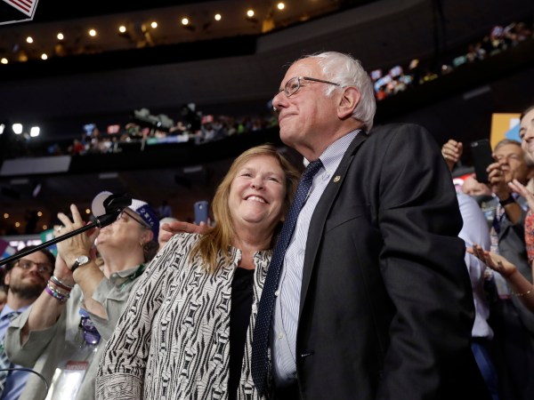 Former Democratic presidential candidate, Sen. Bernie Sanders, I-Vt., hugs wife Jane after standing with the Vermont delegation and asking that Hillary Clinton become the unanimous choice for President of the United States during the second day of the Democratic National Convention in Philadelphia , Tuesday, July 26, 2016. (AP Photo/Matt Rourke)