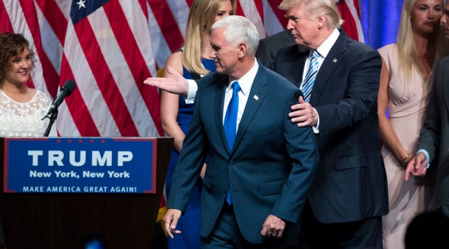 Republican presidential candidate Donald Trump, right, walks with Gov. Mike Pence, R-Ind., during a campaign event to announce Pence as the vice presidential running mate on, Saturday, July 16, 2016, in New York. (AP Photo/Evan Vucci)