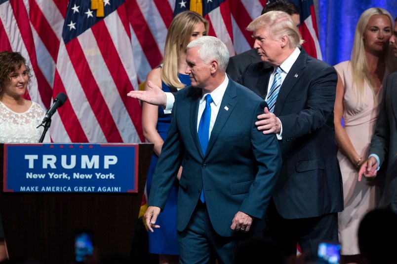Republican presidential candidate Donald Trump, right, walks with Gov. Mike Pence, R-Ind., during a campaign event to announce Pence as the vice presidential running mate on, Saturday, July 16, 2016, in New York. (AP Photo/Evan Vucci)