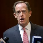 Sen. Pat Toomey, R-Pa., speaks with members of the media during a news conference, Monday, May 9, 2016, in Philadelphia.  Toomey calls on Philadelphia to end its "sanctuary city" policy and begin cooperating with federal law enforcement officers in helping them find immigrants in the country illegally who are suspected of violent crimes. (AP Photo/Matt Rourke)