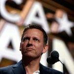Billionaire tech investor Peter Thiel look overr the podium before the start of the second day session of the Republican National Convention in Cleveland, Tuesday, July 19, 2016. (AP Photo/Carolyn Kaster)
