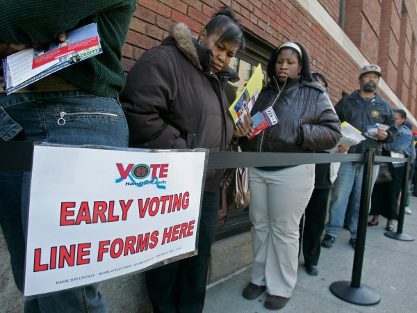 FILE - In this file photo taken Oct. 29, 2008, voters line up outside the Hamilton County Board of Elections for early voting in Cincinnati. U.S. District Judge Michael Watson ruled Tuesday, May 24, 2016, that a law trimming early voting in Ohio is unconstitutional, after the state's Democratic Party and other plaintiffs sued over Republican-backed changes to voting rules in the presidential battleground state. (AP Photo/Al Behrman, File)