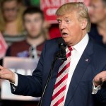 HOLD FOR STORY - FILE – In this Sept. 24, 2016, file photo, Republican presidential candidate Donald Trump gestures during a rally in Roanoke, Va. Countless former Democrats in Ohio's blue-collar Mahoning Valley are transferring their adoration for late U.S. Rep. James Traficant, D-Ohio, to Republican presidential nominee Donald Trump, while those who knew Traficant say similarities to Trump end at the populist bravado and outsized hair. (AP Photo/Steve Helber, File)