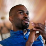 In this March 26, 2016 photo, Baltimore mayoral candidate DeRay Mckesson chats with campaign volunteers before canvassing in Baltimore. Mckesson is known on the national stage for his role in Black Lives Matter, but he's struggling as he campaigns for mayor in his hometown. (AP Photo/Patrick Semansky)