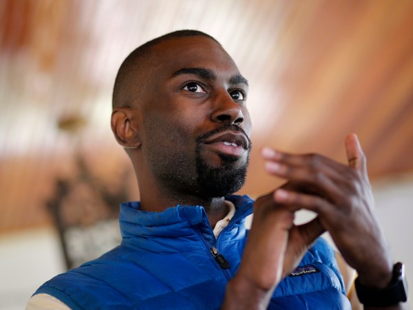 In this March 26, 2016 photo, Baltimore mayoral candidate DeRay Mckesson chats with campaign volunteers before canvassing in Baltimore. Mckesson is known on the national stage for his role in Black Lives Matter, but he's struggling as he campaigns for mayor in his hometown. (AP Photo/Patrick Semansky)
