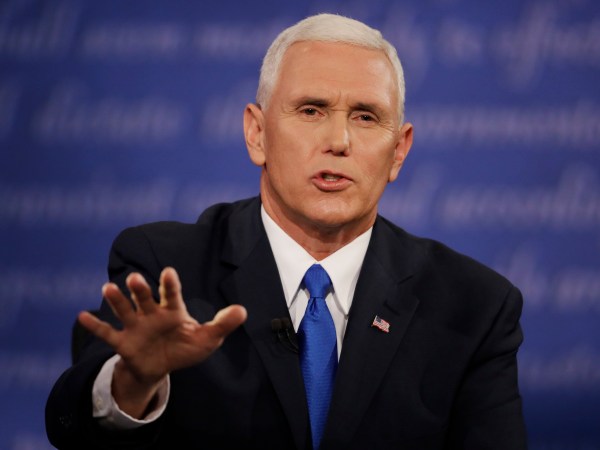 Republican vice-presidential nominee Gov. Mike Pence speaks with Democratic vice-presidential nominee Sen. Tim Kaine during the vice-presidential debate at Longwood University in Farmville, Va., Tuesday, Oct. 4, 2016. (AP Photo/Patrick Semansky)
