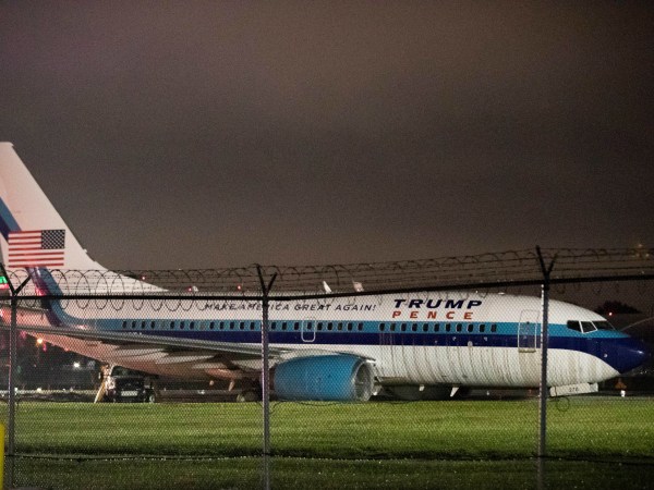 Republican presidential candidate Indiana Gov. Mike Pence's campaign airplane sits partially on the tarmac and the grass after sliding off the runway while landing at LaGuardia airport, Thursday, Oct. 27, 2016, in New York. (AP Photo/Mary Altaffer)