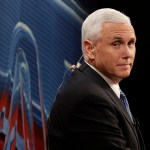 Republican vice-presidential nominee Gov. Mike Pence looks down at the debate floor from a television booth before the start of the third and final presidential debate between Democratic presidential nominee Hillary Clinton Republican presidential nominee Donald Trump in Las Vegas, Wednesday, Oct. 19, 2016. (AP Photo/John Locher)