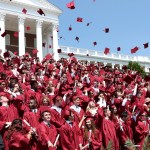 Members of the John Handley High School Class of 2016 toss their mortarboards in the air during commencement exercises at the Winchester, Va. school Saturday, May 28, 2016. (AP Photo, The Winchester Star, Jeff Taylor)
