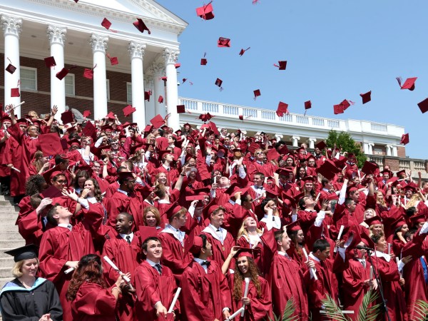 Members of the John Handley High School Class of 2016 toss their mortarboards in the air during commencement exercises at the Winchester, Va. school Saturday, May 28, 2016. (AP Photo, The Winchester Star, Jeff Taylor)