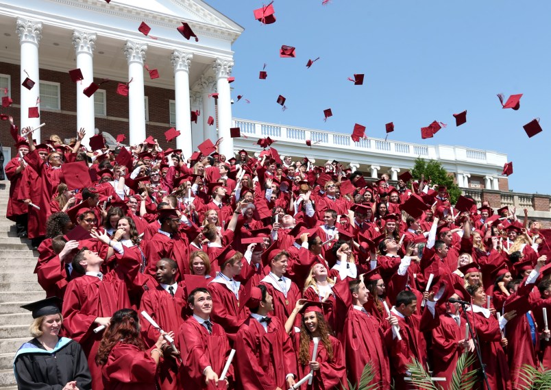 Members of the John Handley High School Class of 2016 toss their mortarboards in the air during commencement exercises at the Winchester, Va. school Saturday, May 28, 2016. (AP Photo, The Winchester Star, Jeff Taylor)