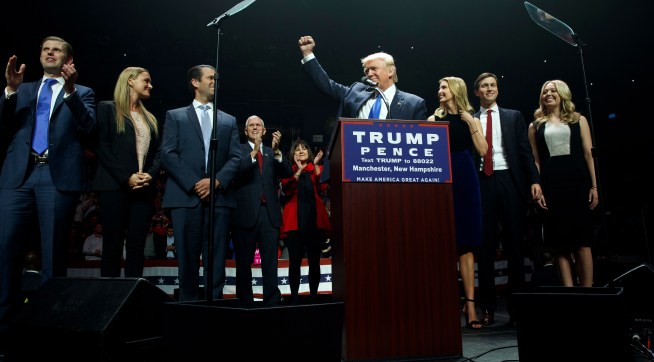 Republican presidential candidate Donald Trump pumps his fist as he arrives to speak during a campaign rally, Monday, Nov. 7, 2016, in Manchester, N.H. From left, Eric Trump, Vanessa Trump, Donald Trump Jr., Republican vice presidential candidate Gov. Mike Pence, R-Ind., Karen Pence, Trump, Ivanka Trump, Jared Kushner, and Tiffany Trump. (AP Photo/ Evan Vucci)