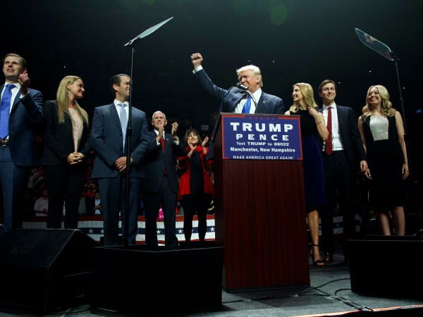 Republican presidential candidate Donald Trump pumps his fist as he arrives to speak during a campaign rally, Monday, Nov. 7, 2016, in Manchester, N.H. From left, Eric Trump, Vanessa Trump, Donald Trump Jr., Republican vice presidential candidate Gov. Mike Pence, R-Ind., Karen Pence, Trump, Ivanka Trump, Jared Kushner, and Tiffany Trump. (AP Photo/ Evan Vucci)