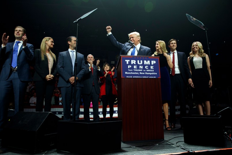 Republican presidential candidate Donald Trump pumps his fist as he arrives to speak during a campaign rally, Monday, Nov. 7, 2016, in Manchester, N.H. From left, Eric Trump, Vanessa Trump, Donald Trump Jr., Republican vice presidential candidate Gov. Mike Pence, R-Ind., Karen Pence, Trump, Ivanka Trump, Jared Kushner, and Tiffany Trump. (AP Photo/ Evan Vucci)