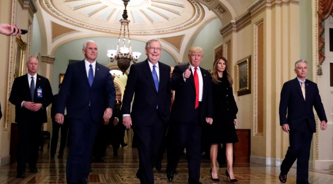 Vice president-elect Mike Pence, second from  left, Senate Majority Leader Mitch McConnell, of Kentucky, President-elect Donald Trump, giving a thumbs up, and Milania Trump walk to a meeting on Capitol Hill, Thursday, Nov. 10, 2016 in Washington. (AP Photo/Alex Brandon)