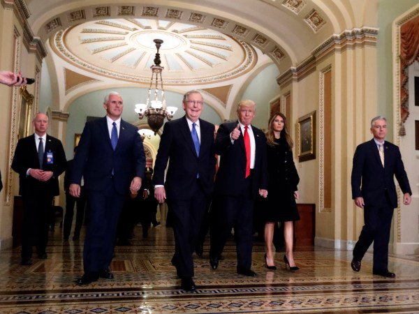Vice president-elect Mike Pence, second from  left, Senate Majority Leader Mitch McConnell, of Kentucky, President-elect Donald Trump, giving a thumbs up, and Milania Trump walk to a meeting on Capitol Hill, Thursday, Nov. 10, 2016 in Washington. (AP Photo/Alex Brandon)