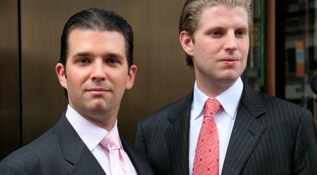 Donald Trump, Jr., left, and his brother Eric pose for photographers after attending the opening of the Trump SoHo New York, Friday, April 9, 2010. The 46 story hotel condominium has 391 units. (AP Photo/Mark Lennihan)