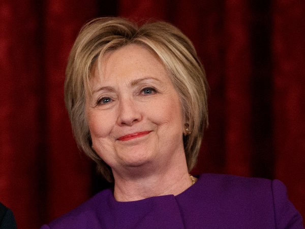 Vice President Joe Biden, left, talks with former Secretary of State Hillary Clinton during a ceremony to unveil a portrait of Senate Minority Leader Harry Reid, D-Nev., on Capitol Hill, Thursday, Dec. 8, 2016, in Washington. (AP Photo/Evan Vucci)