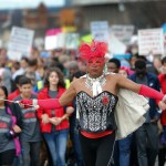 Demonstrators march Saturday, Jan. 21, 2017, in Atlanta. Thousands of people marched through Atlanta one day after President Donald Trump's inauguration. (AP Photo/John Bazemore)