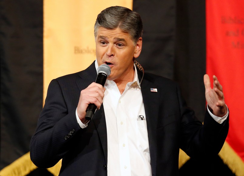 Fox News Channel's Sean Hannity speaks during a campaign rally for Republican presidential candidate, Sen. Ted Cruz, R-Texas, Friday, March 18, 2016, in Phoenix. (AP Photo/Rick Scuteri)