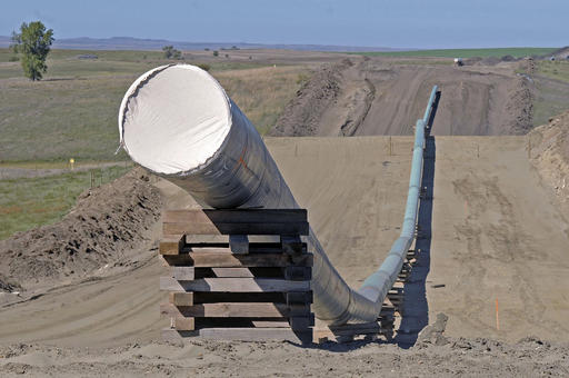 FILE - In this Sept. 29, 2016, file photo, shows a section of the Dakota Access Pipeline under construction  near the town of St. Anthony in Morton County, N.D. Texas-based Energy Transfer Partners, the company building the oil pipeline, asked a a federal judge on Tuesday, Jan. 17, 2017, to block the U.S. Army Corps of Engineers from launching a full environmental study of the $3.8 billion pipeline's disputed crossing of a Missouri River reservoir in North Dakota. (Tom Stromme/The Bismarck Tribune via AP, File)