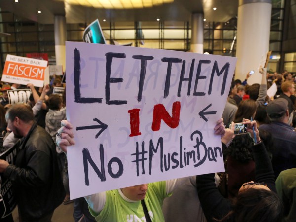 People opposed to President Donald Trump's executive orders barring entry to the U.S. by Muslims from certain countries demonstrate at the Tom Bradley International Terminal at Los Angeles International Airport Saturday, Jan. 28, 2017. (AP Photo/Reed Saxon)