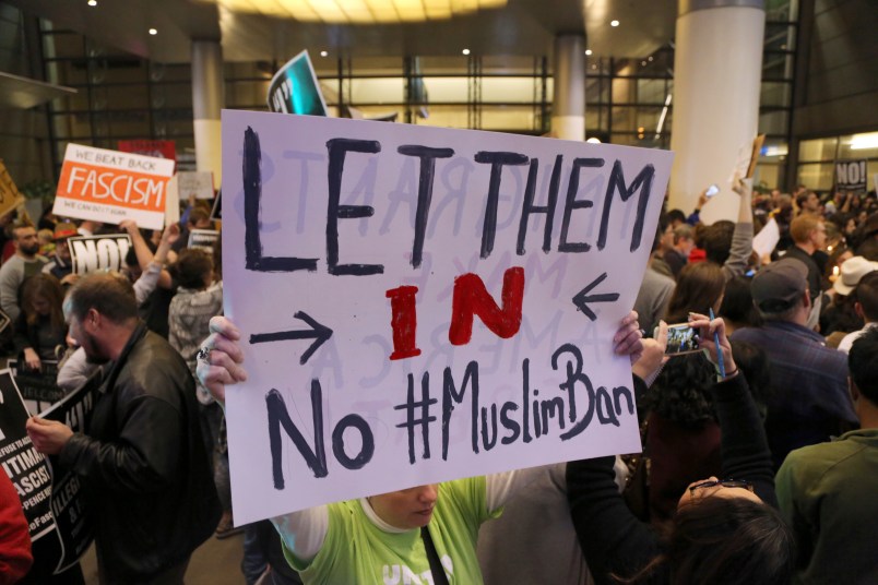 People opposed to President Donald Trump's executive orders barring entry to the U.S. by Muslims from certain countries demonstrate at the Tom Bradley International Terminal at Los Angeles International Airport Saturday, Jan. 28, 2017. (AP Photo/Reed Saxon)
