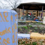 FILE – In this Dec. 29, 2015, file photo, "R.I.P. Tamir Rice" is written on a wooden post near a makeshift memorial at the gazebo where a white patrol officer fatally shot the boy on Nov. 22, 2014, outside the Cudell Recreation Center in Cleveland. A disciplinary hearing for 911 dispatcher Constance Hollinger took place Friday, Feb. 24, 2017, with Hollinger facing possible suspension for up to 10 days on internal disciplinary charges she failed to relay that a 911 caller reporting “a guy” pointing a gun said the male could be a juvenile and the gun might be a “fake.” (AP Photo/Tony Dejak, File)