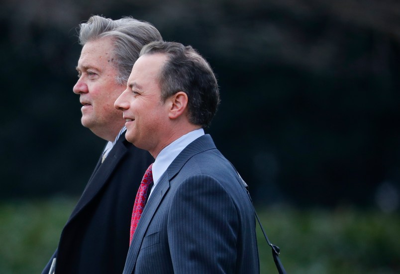 Chief White House Strategist Steve Bannon, left, walks with White House Chief of Staff Reince Priebus, right, to Marine One on the South Lawn of the White House in Washington, Friday, Feb. 17, 2017. (AP Photo/Pablo Martinez Monsivais)
