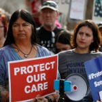 State Sen. Dr. Irene Aguilar, D-Denver, left, stands with activist Christina Postolowski, of the group Young Invincibles, as supporters of the Affordable Care Act who are also opponents of Colorado's GOP-led plan to undo Colorado's state-run insurance exchange hold a rally on the state Capitol steps in Denver, Tuesday, Jan. 31, 2017. The state GOP measure, a bill which would dismantle Connect For Health Colorado within a year, is an indication of how Republicans plan to chip away at Obamacare. If the federal health care law remains unchanged, it would force Coloradans shopping for private insurance to use the federal exchange. (AP Photo/Brennan Linsley)