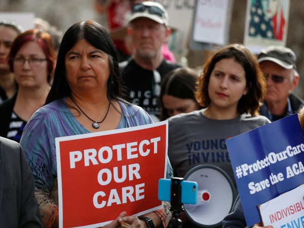 State Sen. Dr. Irene Aguilar, D-Denver, left, stands with activist Christina Postolowski, of the group Young Invincibles, as supporters of the Affordable Care Act who are also opponents of Colorado's GOP-led plan to undo Colorado's state-run insurance exchange hold a rally on the state Capitol steps in Denver, Tuesday, Jan. 31, 2017. The state GOP measure, a bill which would dismantle Connect For Health Colorado within a year, is an indication of how Republicans plan to chip away at Obamacare. If the federal health care law remains unchanged, it would force Coloradans shopping for private insurance to use the federal exchange. (AP Photo/Brennan Linsley)
