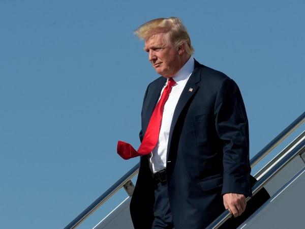 President Donald Trump walks down the steps of Air Force One as he arrives a Palm Beach International Airport in West Palm Beach, Fla., Friday, Feb. 17, 2017. Trump is spending a third weekend in a row at his Mar-a-Lago estate. (AP Photo/Susan Walsh)