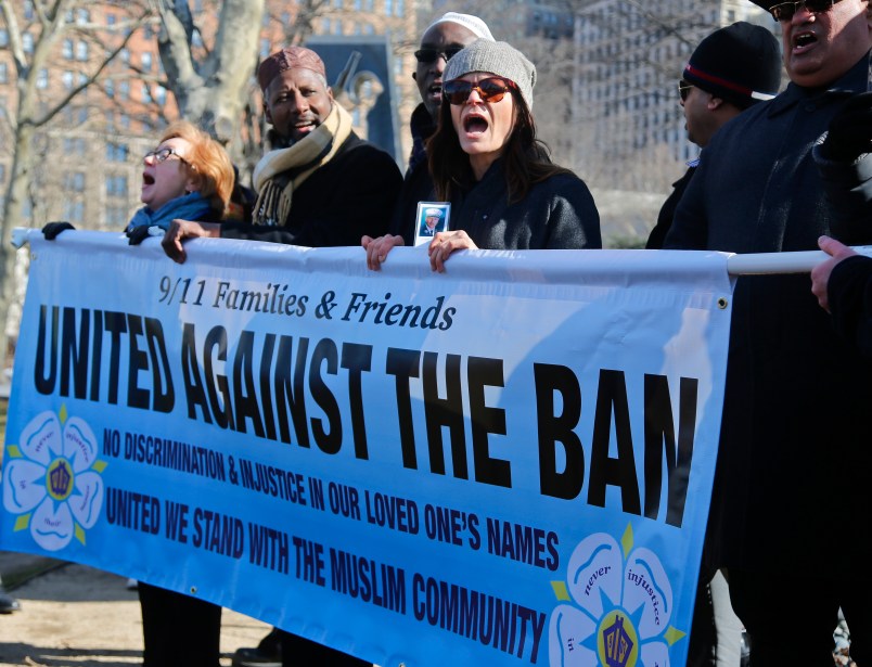 A recently formed group of Sept. 11 families and supporters rally during a press conference, Thursday Feb. 16, 2017, in Battery Park, N.Y. Group spokesman John Sigmund, who lost his sister Johanna Sigmund in the Sept. 11 attacks, said the group "9/11 Families and Friends United Against the Ban," came together two weeks ago ago speak "out against this deplorable Muslim ban that was in the recent executive order by President Trump."(AP Photo/Bebeto Matthews)