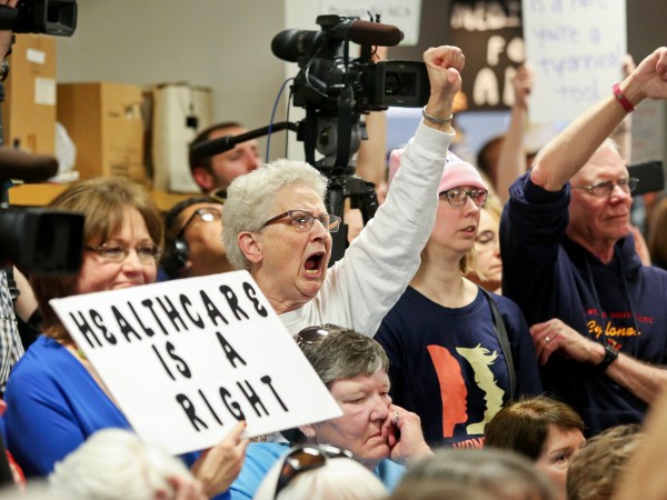 Cleone Hermsen, of Carroll, Iowa, expresses her criticism while listening to U.S. Sen. Joni Ernst, R-Iowa, during a veterans roundtable event at Maquoketa City Hall on Tuesday, Feb. 21, 2017, Maquoketa, Iowa.  The City Council chambers, where the event was taking place, was at capacity while more than 100 people were unable to enter. (AP/Telegraph Herald/Nicki Kohl)