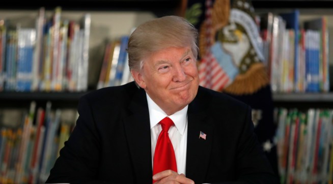 President Donald Trump smiles as he participates in a round table discussion during a tour of Saint Andrew Catholic School, Friday, March 3, 2017, in Orlando, Fla. (AP Photo/Alex Brandon)
