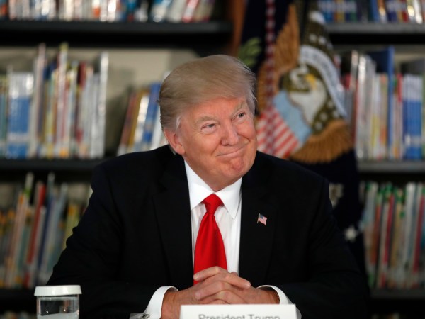 President Donald Trump smiles as he participates in a round table discussion during a tour of Saint Andrew Catholic School, Friday, March 3, 2017, in Orlando, Fla. (AP Photo/Alex Brandon)