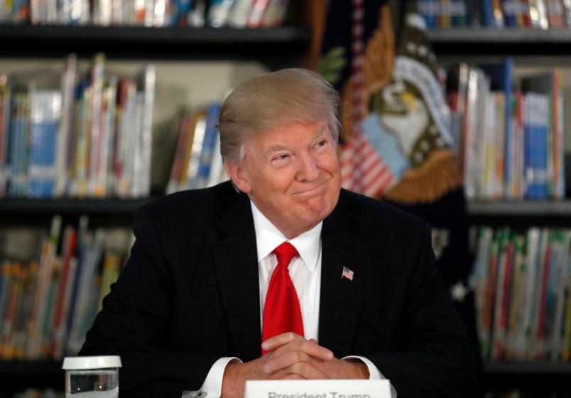 President Donald Trump smiles as he participates in a round table discussion during a tour of Saint Andrew Catholic School, Friday, March 3, 2017, in Orlando, Fla. (AP Photo/Alex Brandon)
