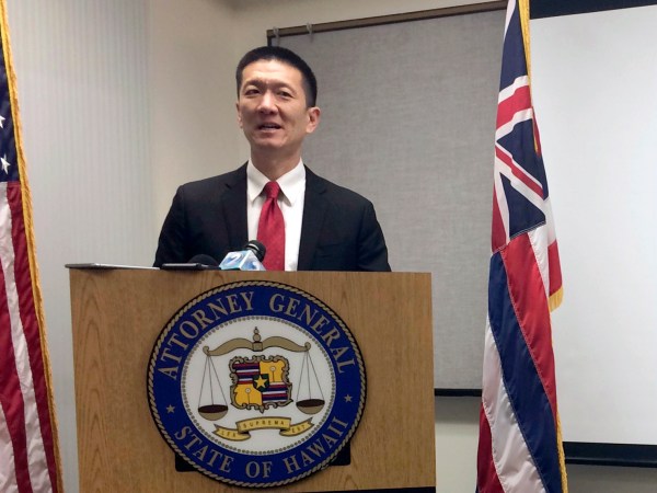 FILE - In this Feb. 3, 2017, file photo, Hawaii Attorney General Doug Chin speaks at a news conference in Honolulu announcing the state of Hawaii has filed a lawsuit challenging President Donald Trump's travel ban. Hawaii is planning to challenge Trump's revised travel ban. A motion filed in federal court on Tuesday, March 7, 2017, in Honolulu says the state wants to amend its existing lawsuit challenging Trump's previous order.  (AP Photo/Audrey McAvoy, File)